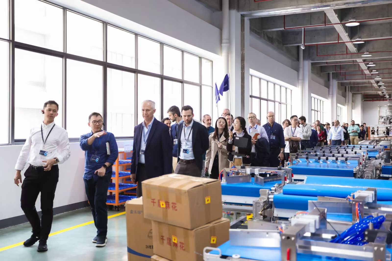 Customers viewing the conveyor assembly line